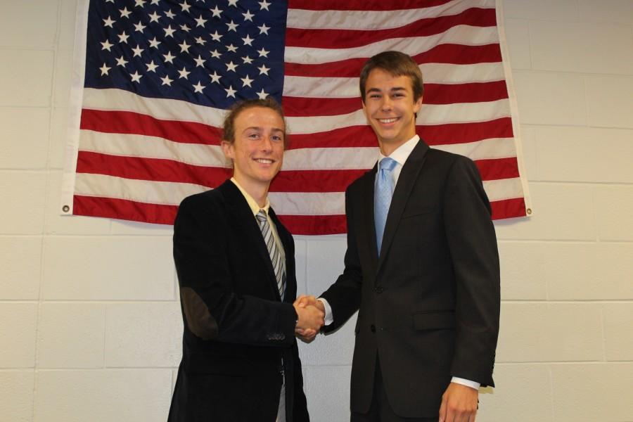 Canidates Johnathon Corbin and Keagan Campinelli shake hands before the vote commences. (Photo by Patrick Dieter)