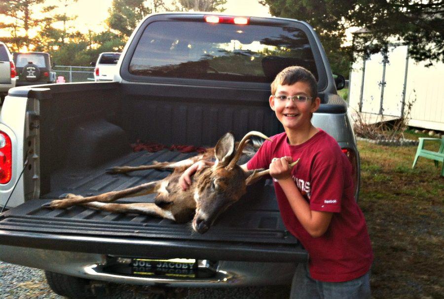 FCHS Student Leukas Koczan shows off the fruits of hunting with his dad, teacher Jimmy Koczan.
