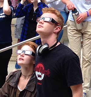 Siblings Joey and Sam Hagan enjoy an unobstructed view of the eclipse in the FCHS courtyard on Aug. 21.
Photo courtesy of Carolynne Hagan