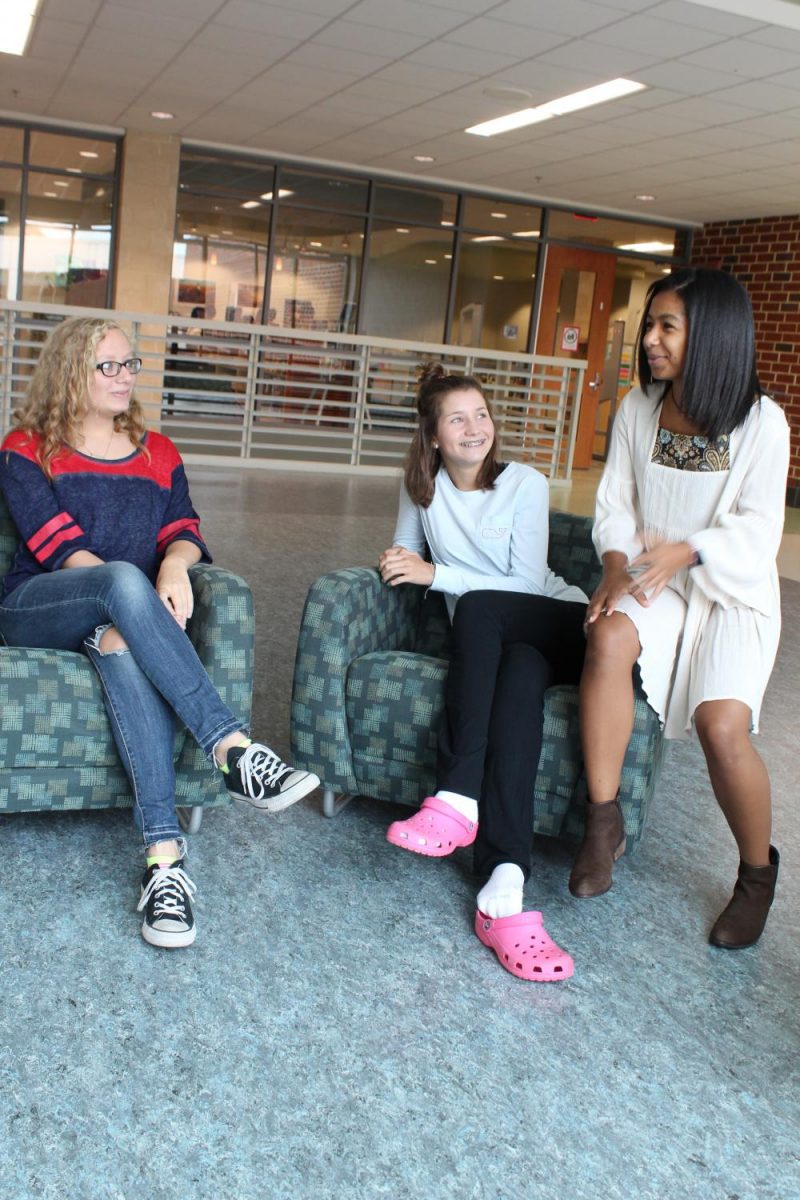 Sophmores Amina Wilson, Madelyn Grubbs, and Kristen Pace chat excitedly outside the library.
Photo courtesy of Jules Shepard