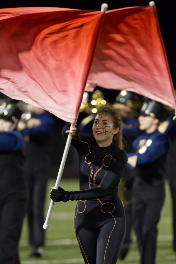 Senior Jordan Reimers performing with the Guard during half time on Nov. 3. Photo courtesy of Fluvannaphotos.com