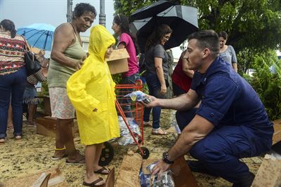 The Coast Guard delivering essentials to Puerto Ricans
Photo courtesy of https://www.defense.gov/News/Article/Article/1342307/13700-dod-personnel-respond-to-hurricane-maria-relief-effort/ under Creative Common license 