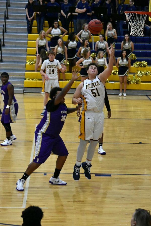 Sophomore+Walter+Stribling+going+for+a+rebound.+Photo+courtesy+of+Flying+Flucos+Sports+Shots
