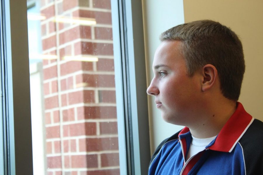 Freshman Damon Everard looking out over the courtyard. Photo courtesy of Kristen Pace