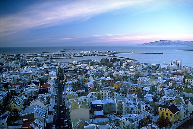 View of Reykjavík from the tower of Hallgrímskirkja. Photo taken 4 Feb 2003. Photo courtesy of Andreas Tille via Wikimedia Commons under Creative Commons Attribution-Share Alike 3.0 Unported. 
https://commons.wikimedia.org/wiki/File:Reykjav%C3%ADk_s%C3%A9%C3%B0_%C3%BAr_Hallgr%C3%ADmskirkju.jpeg 
