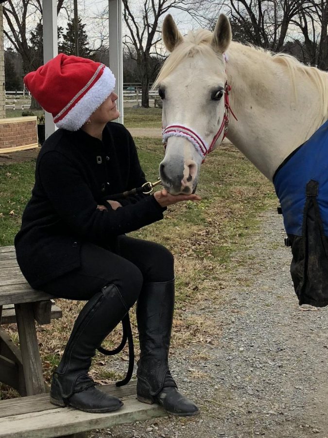 Christine Transue spending some quality down time with her horse Phil. Photo courtesy of Christine Transue.