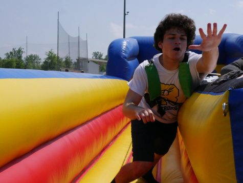 Senior Ethan Vernatter fights to make it to the finish line in the bungee race at the Decision Day party on May 1. Photo courtesy of David Small. 