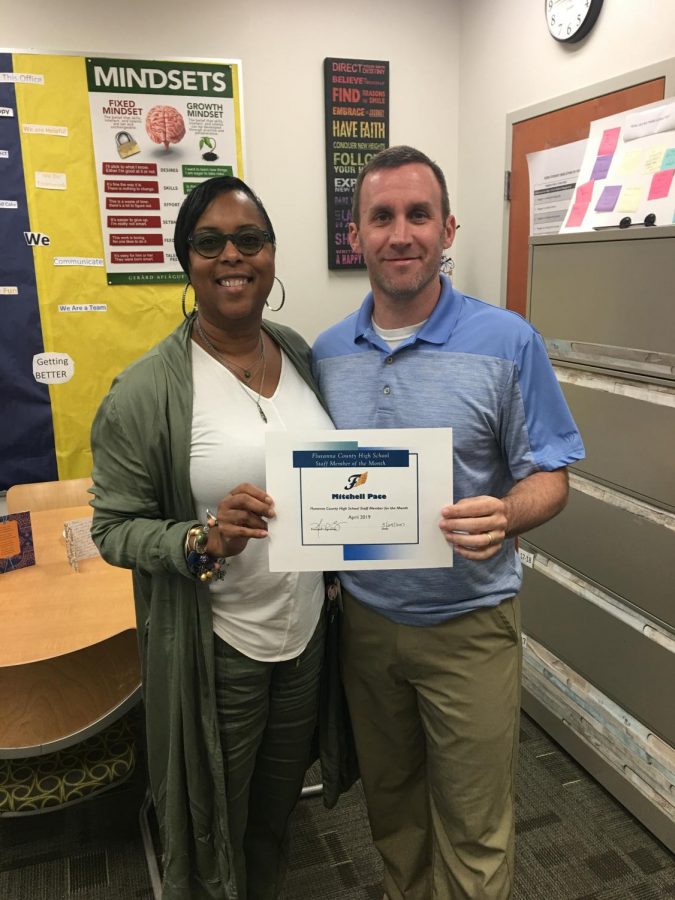 Mr. Pace receiving his Staff Member of the Month from Mrs. Bruce