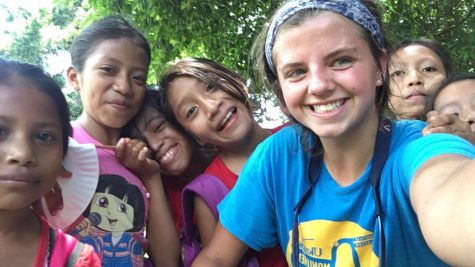 MaryAnn posing with some of the Guatemalan children