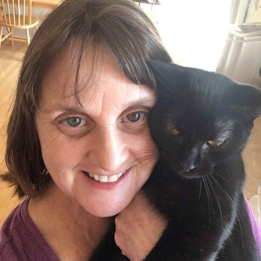 Victoria Zavadsky posing with her cat, Oscar