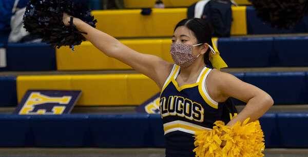 Junior Evie Benson cheers at the Dec. 29 varsity girls basketball game at FCHS. 