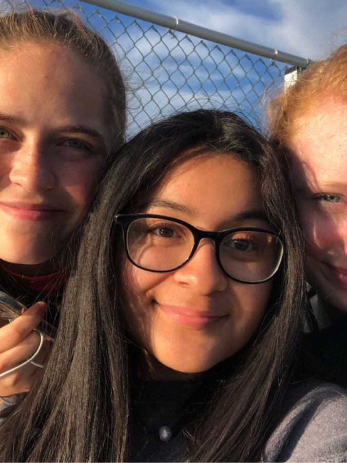 Girls soccer manager Paola Gomez Melgares (center) with players RIley Yowell and Sydney Forren. 
