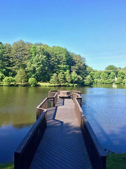 Take a walk down the pier in Arbor Lake Forest Lakes.