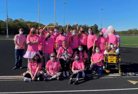 EMT Teacher Sharon Payne poses with all of her students at the annual Breast Cancer Walk.