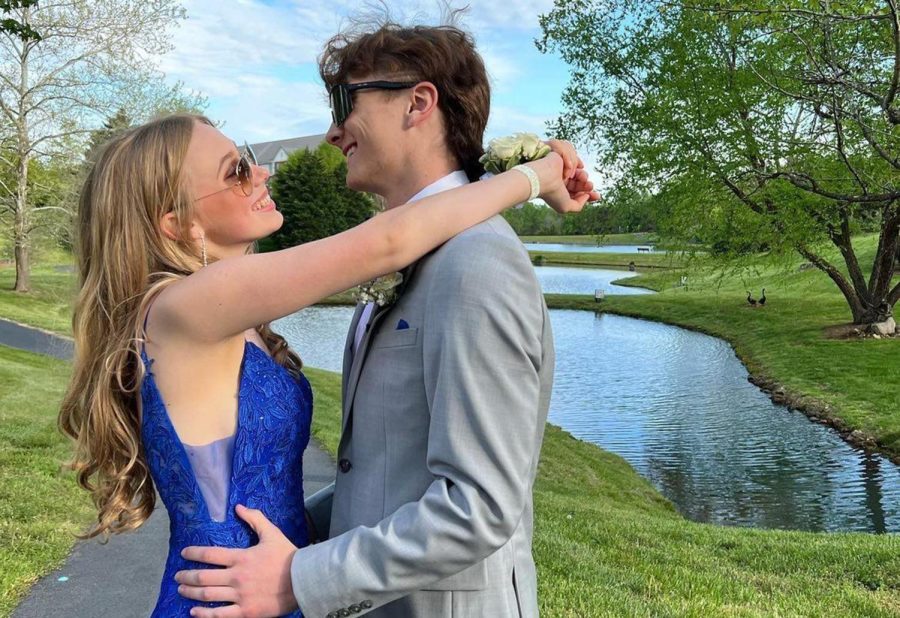 John Glasscock and Ellie Kennedy taking pictures together before prom.