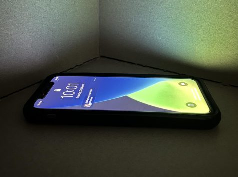 Phone screen lighting up in the dark.