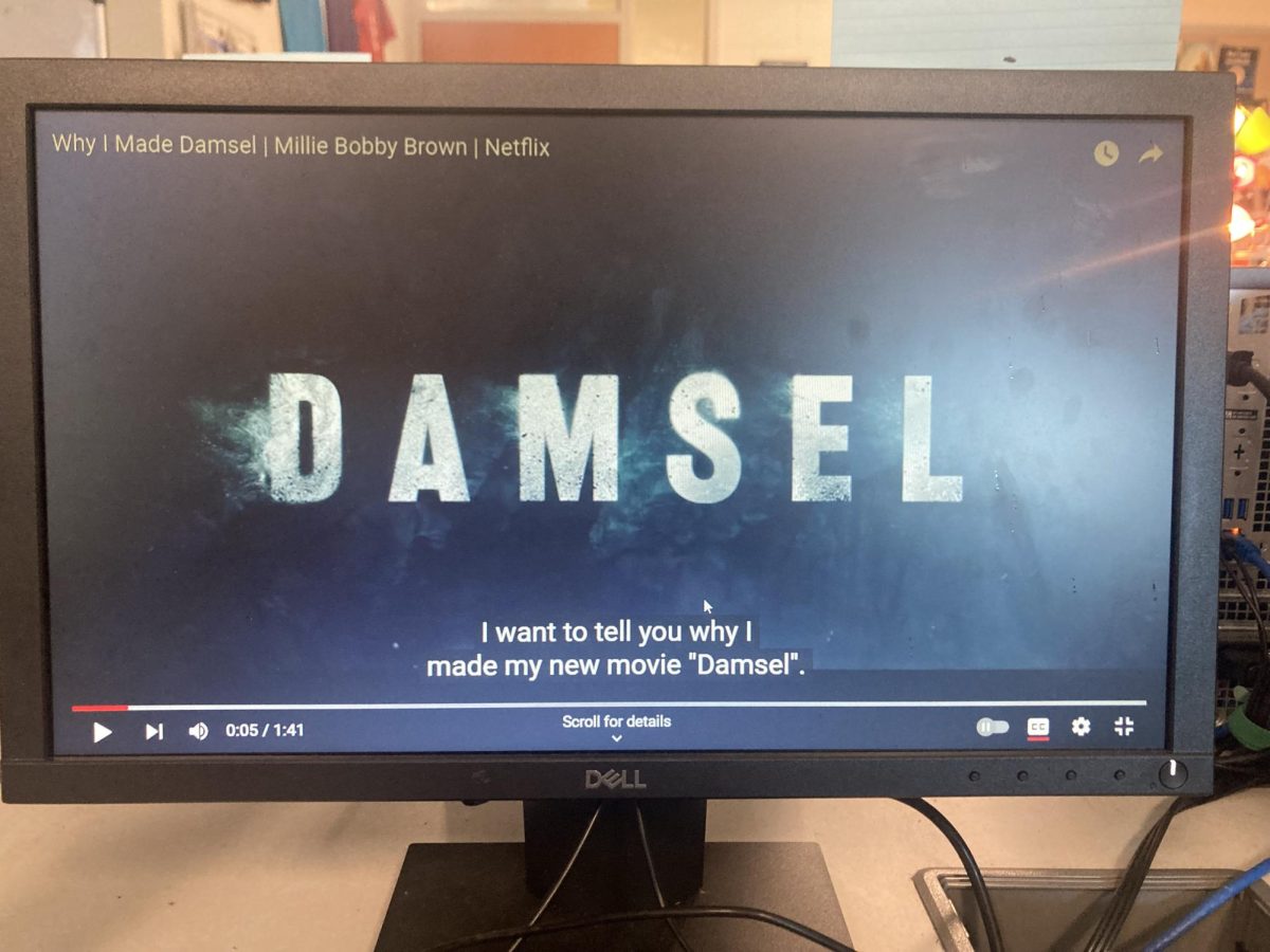A photo of the title screen from a YouTube interview with Millie Bobby Brown about why she made the movie Damsel. Video available on YouTube channel Netflix: Behind the Streams. Why I Made Damsel | Millie Bobby Brown | Netflix by Netflix: Behind the Streams Photo courtesy of Kessler Potter.
