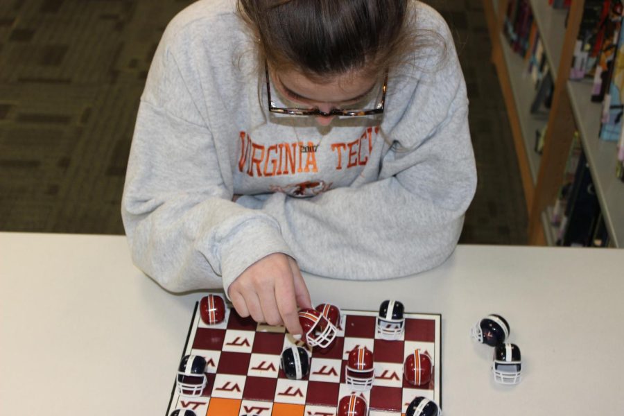 A+student+plays+chess+in+the+4th+floor+Media+Center.+