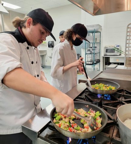 Culinary Students, Caleb Walker and Christine Ireland, making Teriyaki Chicken Stir-fry
