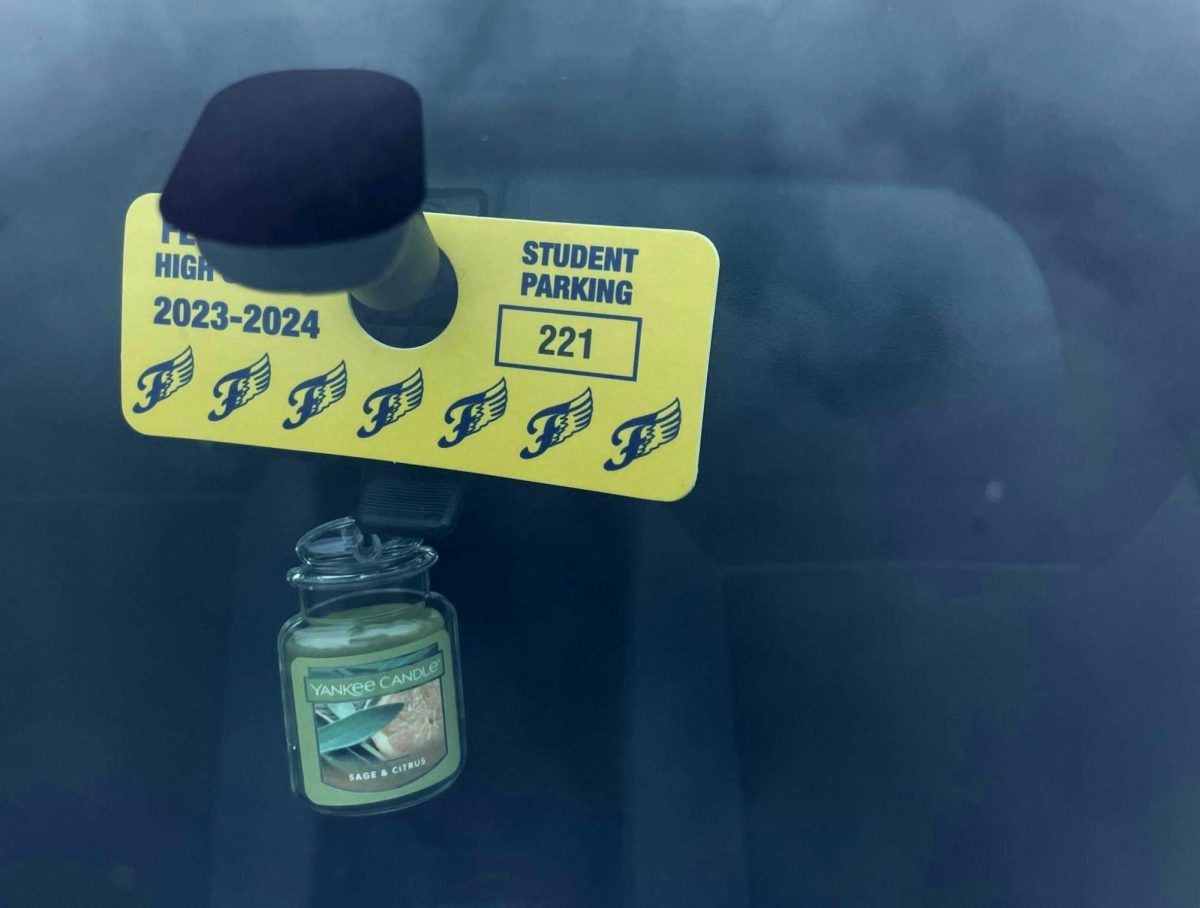 An FCHS parking pass hung in a car in the senior lot. 