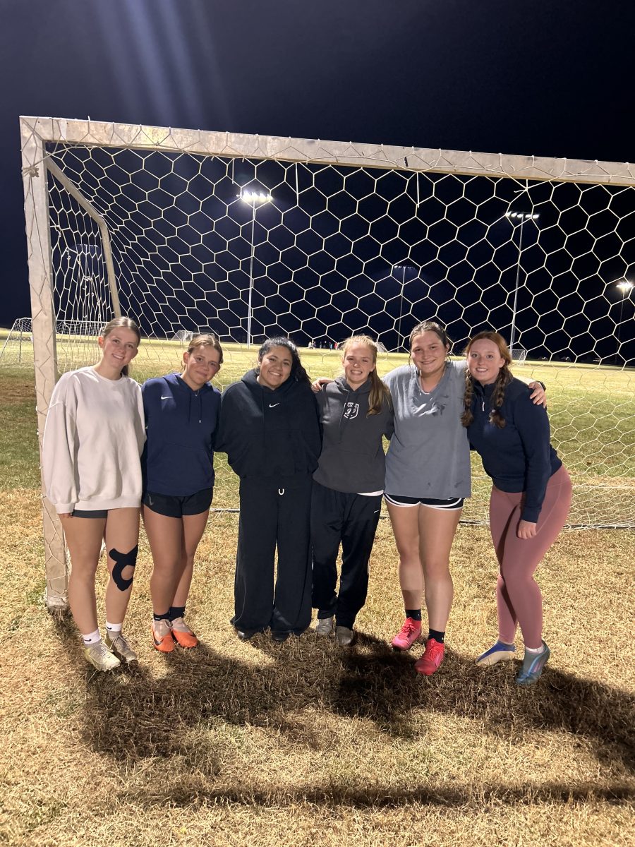 FYSA U18 Girls Travel Seniors pose with Coaches Lexi Cook and Alex Valladares for their last club practice.