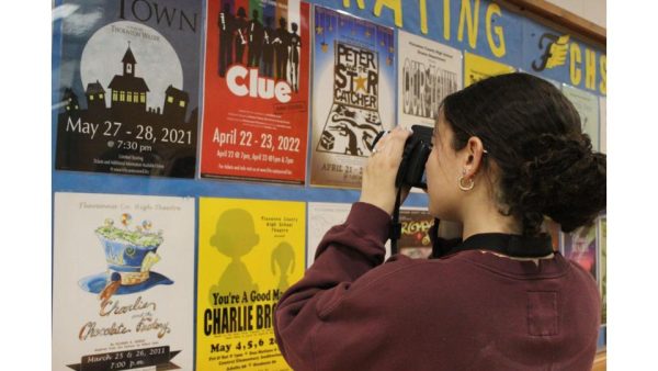 FCHS Journalism student captures pictures of old theatre posters. Photo courtesy of Ellie Sam.