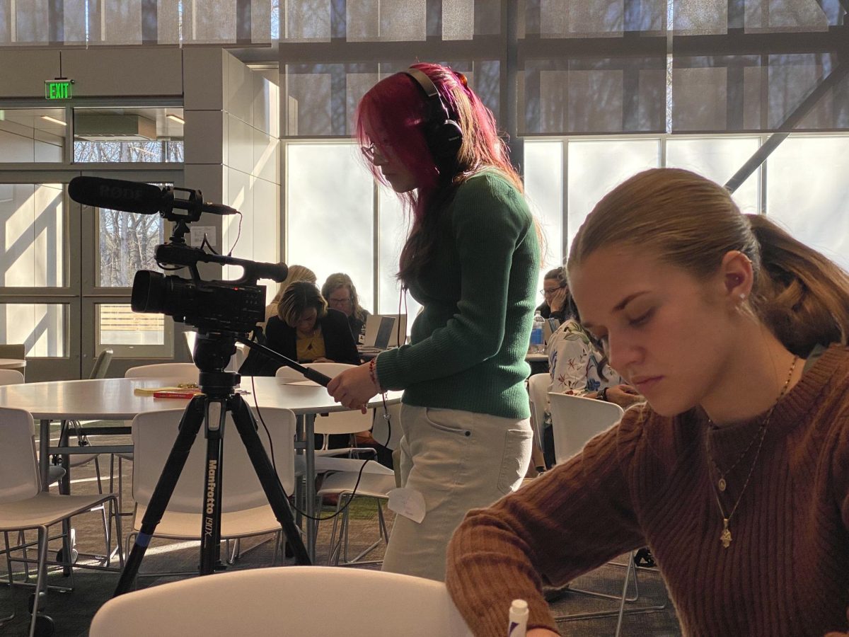  Juniors Townes Mullinex and  Camryn Ngov working as documentarians at the Henrico County ACE center and The Virginia Leads Innovation Network. Photo courtesy of David Small