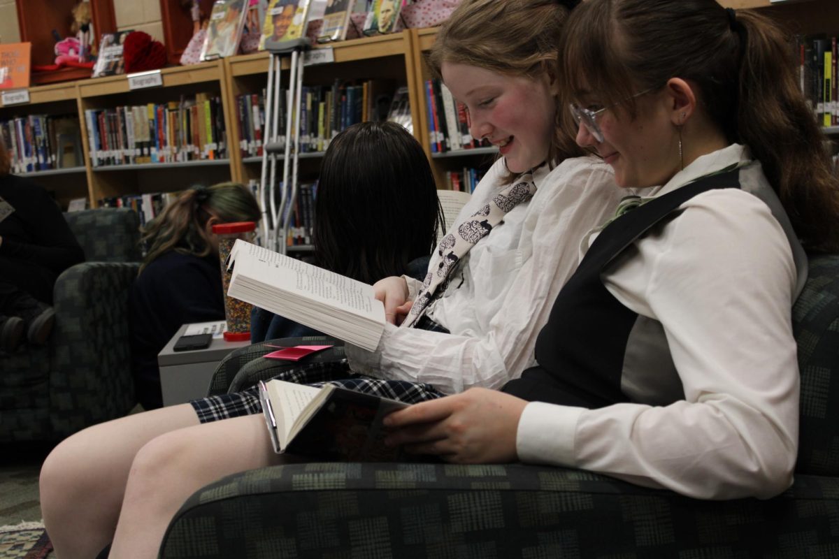 Eighth graders Annika Potter and Jaden  Philpott read during Read Across America. Photo courtesy of Marley Rochester