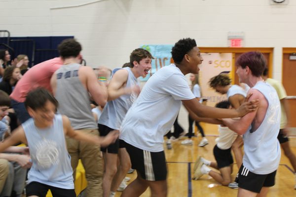 The freshmen class get hype congratulating each other after beating the senior class, insuring their official win of the Macho Man game on March 29. Photo courtesy of Cecily McMillian. 