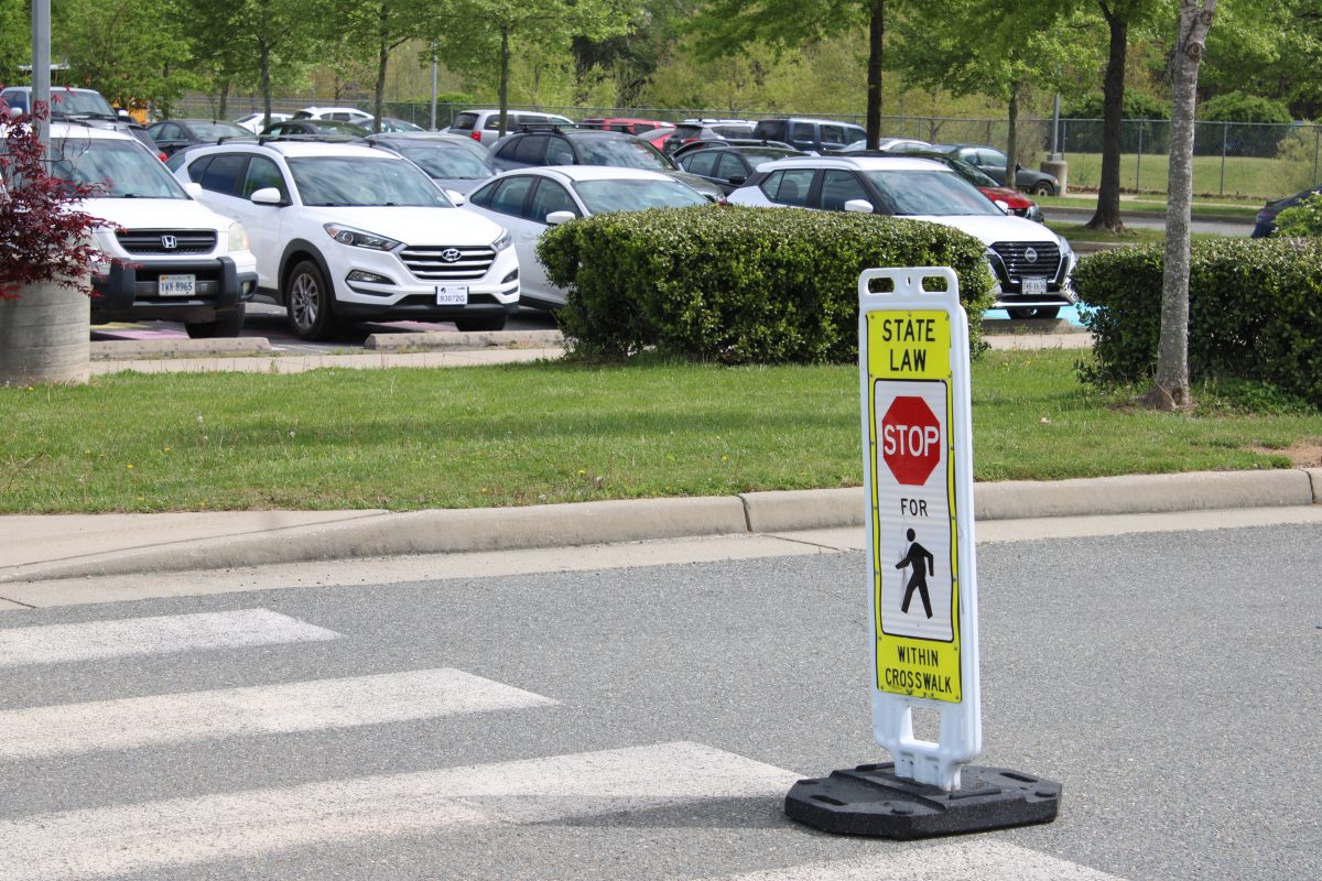 The pedestrian stop sign next to the parking lot crosswalk. Photo courtesy of Jennifer Wyant. 