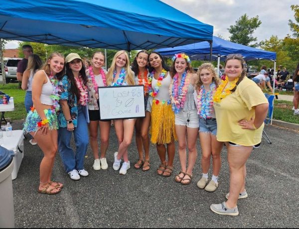 FCHS seniors gather in the parking lot to show off their tropical-themed attire for the first home game.