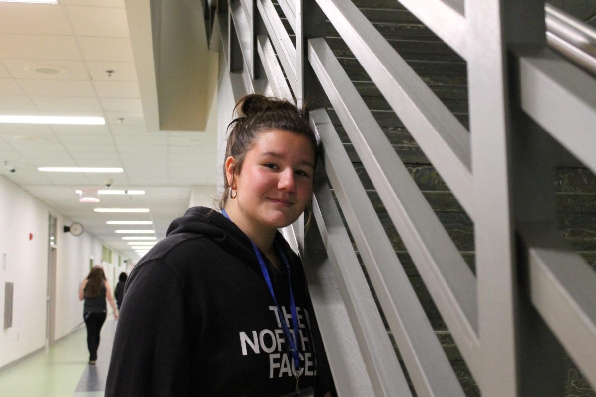 Molly Cook leaned up against the stair railings. Photo Courtesy of Madeline Hamel.