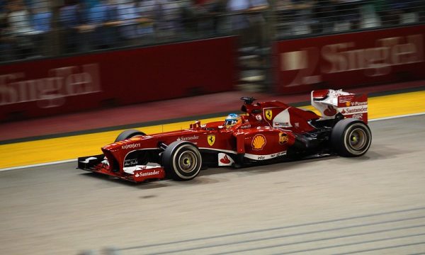 An F1 Driver racing for Team Ferrari at the Singapore GP. Photo courtesy of Romain Pontida.

