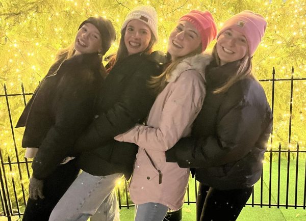 Sophomores Blair Marshall, Claire Bomberger, Lily Hagan, and Mallory Esch celebrate the start of the holiday season under the lit Christmas tree at Charlottesville's Grand Illumination.