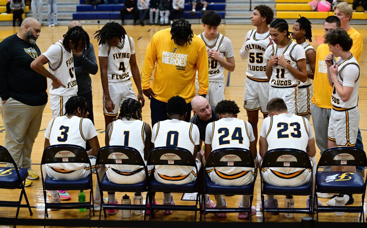 The varsity boys basketball team during half-time at a match at FCHS in January, 2025. 