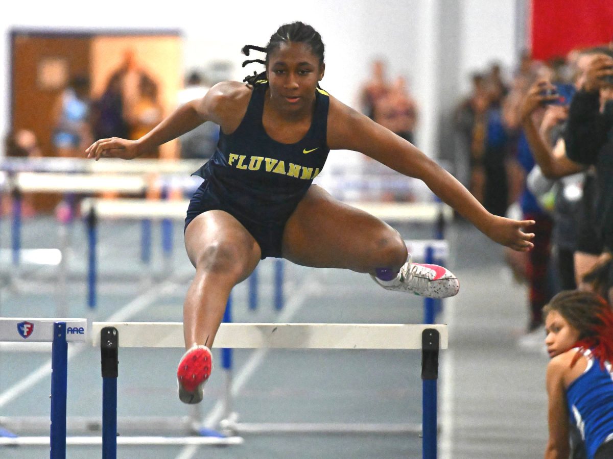 '24 FCHS graduate Alexis Perry leaps over a hurdle during the 2024 indoor track season.