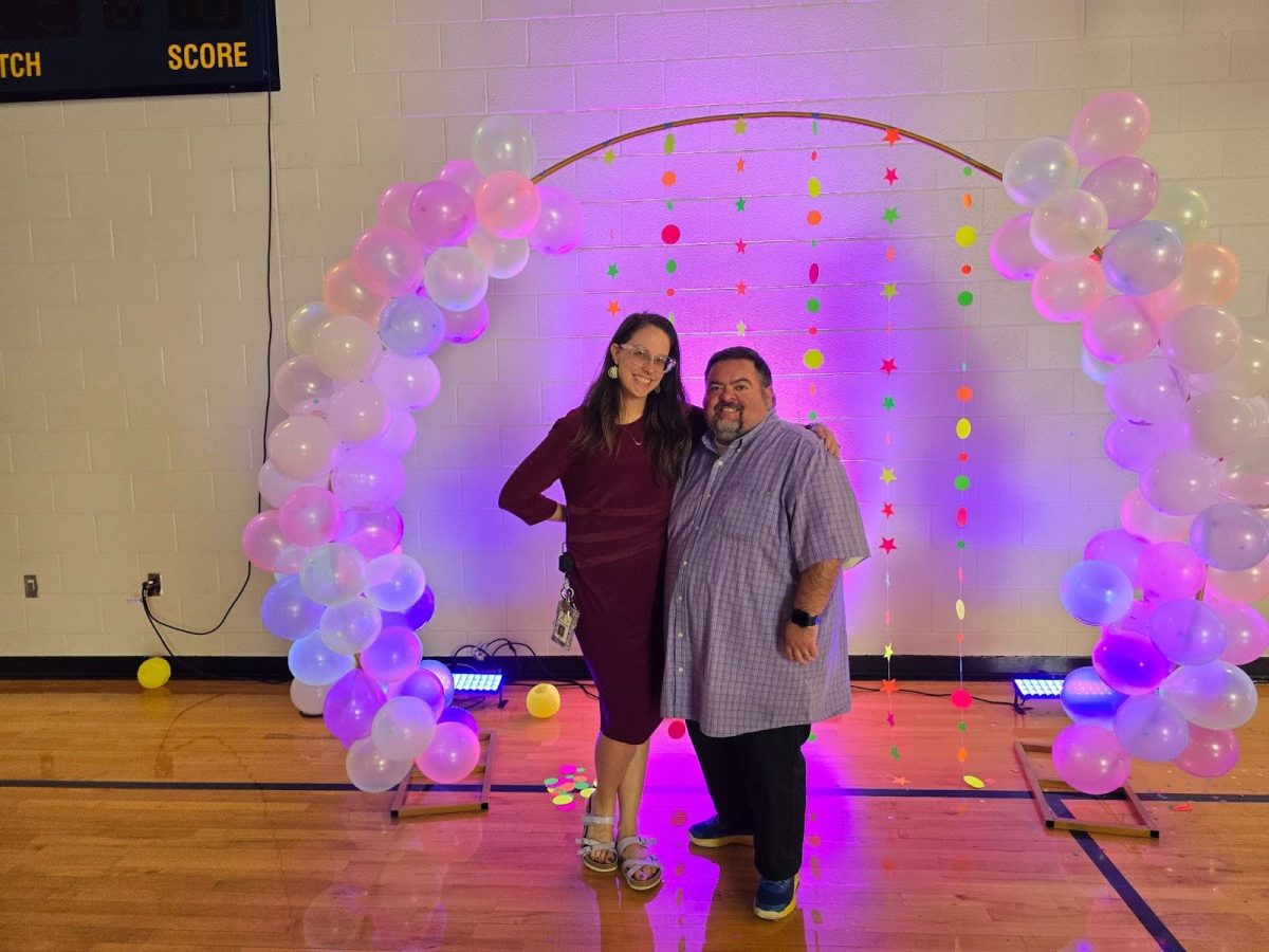 Special education teachers Amy Hill and Nick Ward take a photo under the balloon arch. “Our homecoming is such a special inclusion event for our students to hang out with each other and SGA students for dancing, photos, and fun. It gives our classes time and space to be free and have fun. The best part is sharing in their joy,” said Hill.