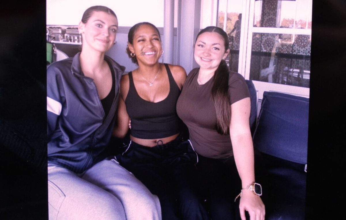 Molly McCall, Mia Grace Dixon, and Ashley Monahan have fun on the senior trip to drive shack.