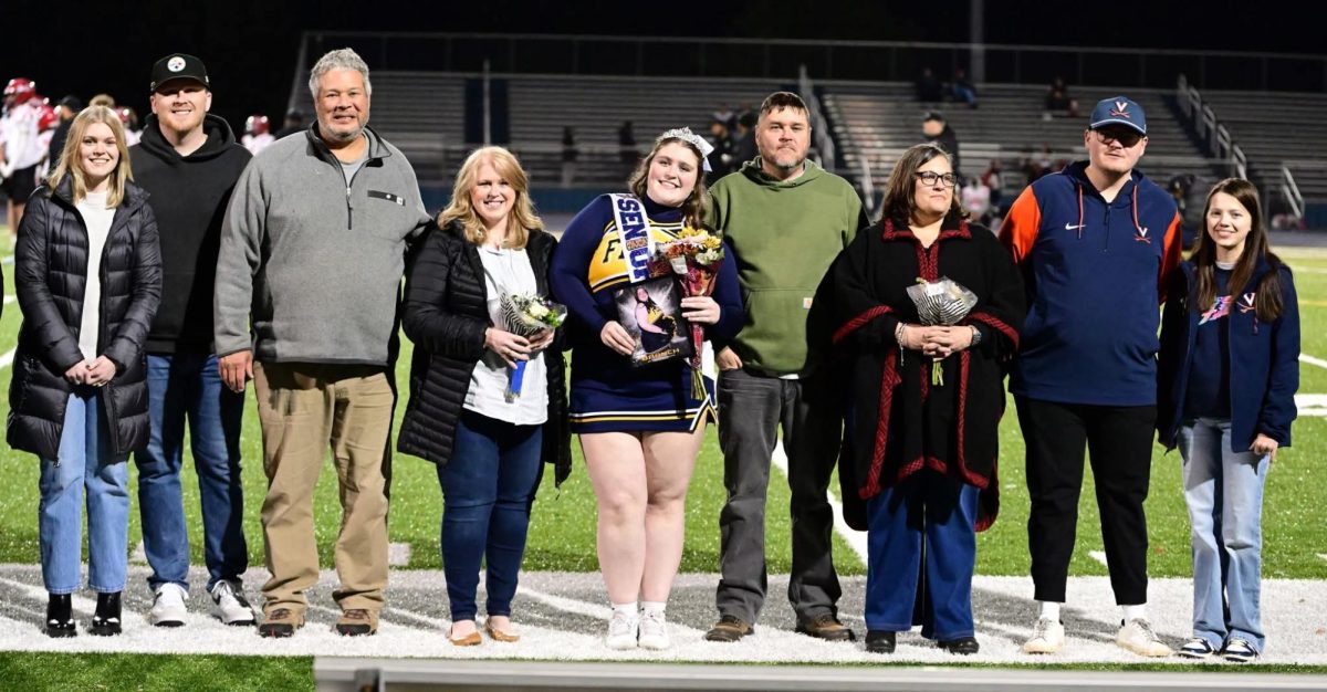 Senior cheerleader Sophia Branch and her family during senior night.