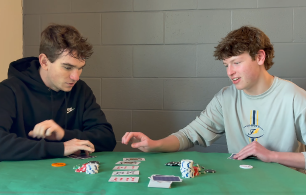 Juniors Dawson Raines and Peter Fulk play cards in reference to the FCHS '26 prom theme.