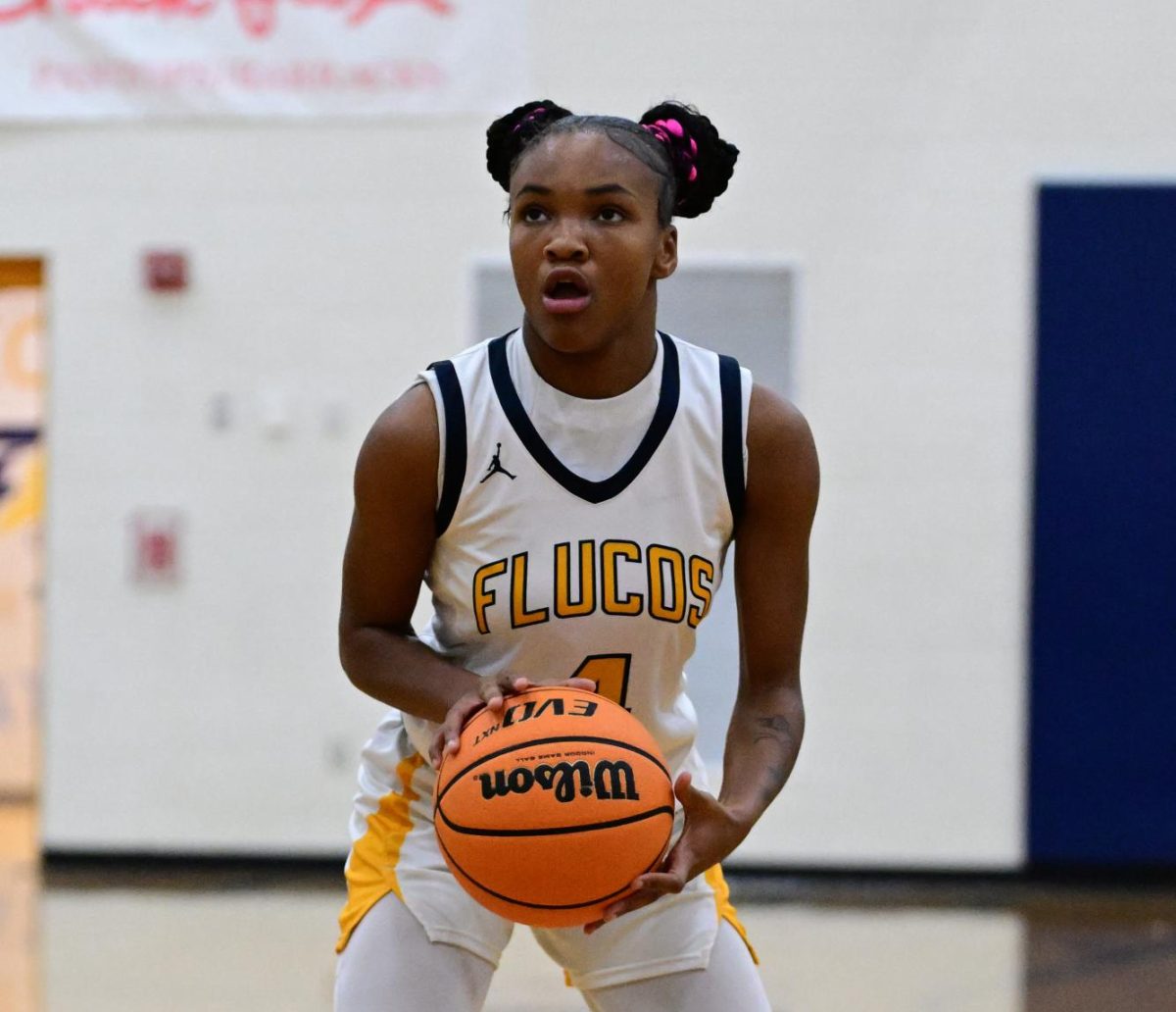 Junior Azaiya Miles at a home varsity girls basketball game.
