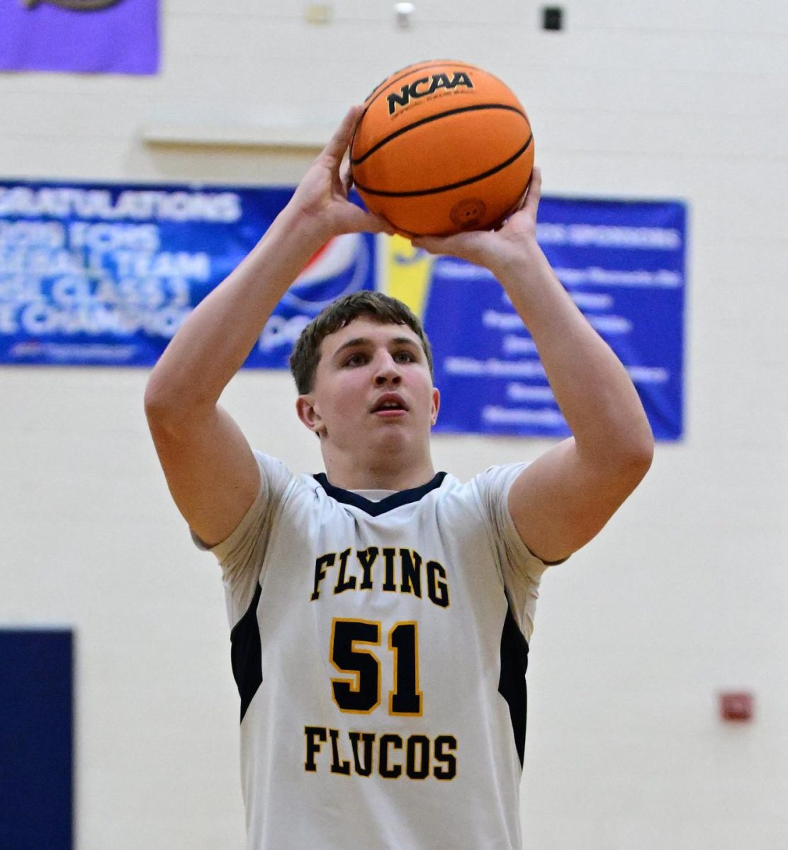 Elijah Stribling '29 #51 makes a free-throw at a home JV basketball game. 

