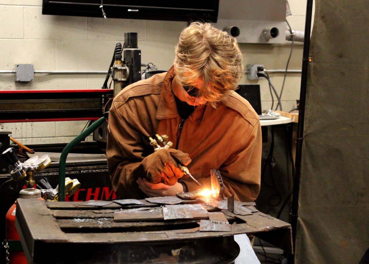 Christopher Madison '26 welds in Russell Jennings' Agricultural Fabrication CTE class .