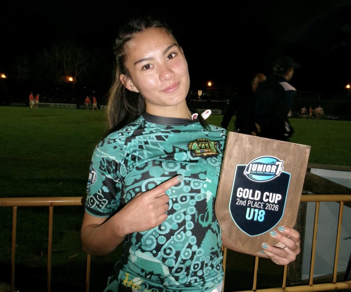 Kaiya Wrigley '26 with the 2nd place Lisbon Junior Seven plaque her team was awarded in Portugal.  