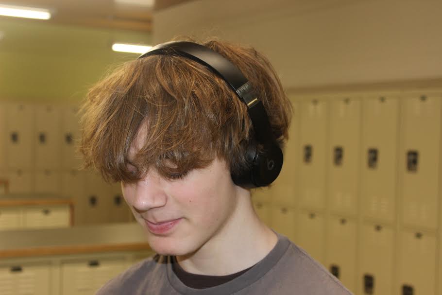 Micah Wood '28 listening to music in the locker bay.