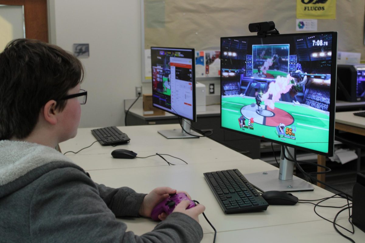 An Esports gamer practices playing a video game after school. 