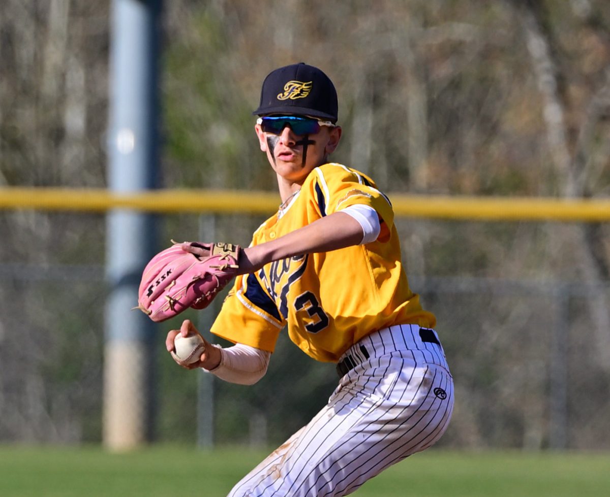Austin Martin '28 prepares to throw at a home game during the 2025-2026 JV baseball season.