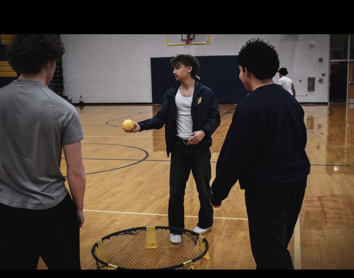 Timothy Smeds '28 plays spikeball in the gymnasium with some friends.