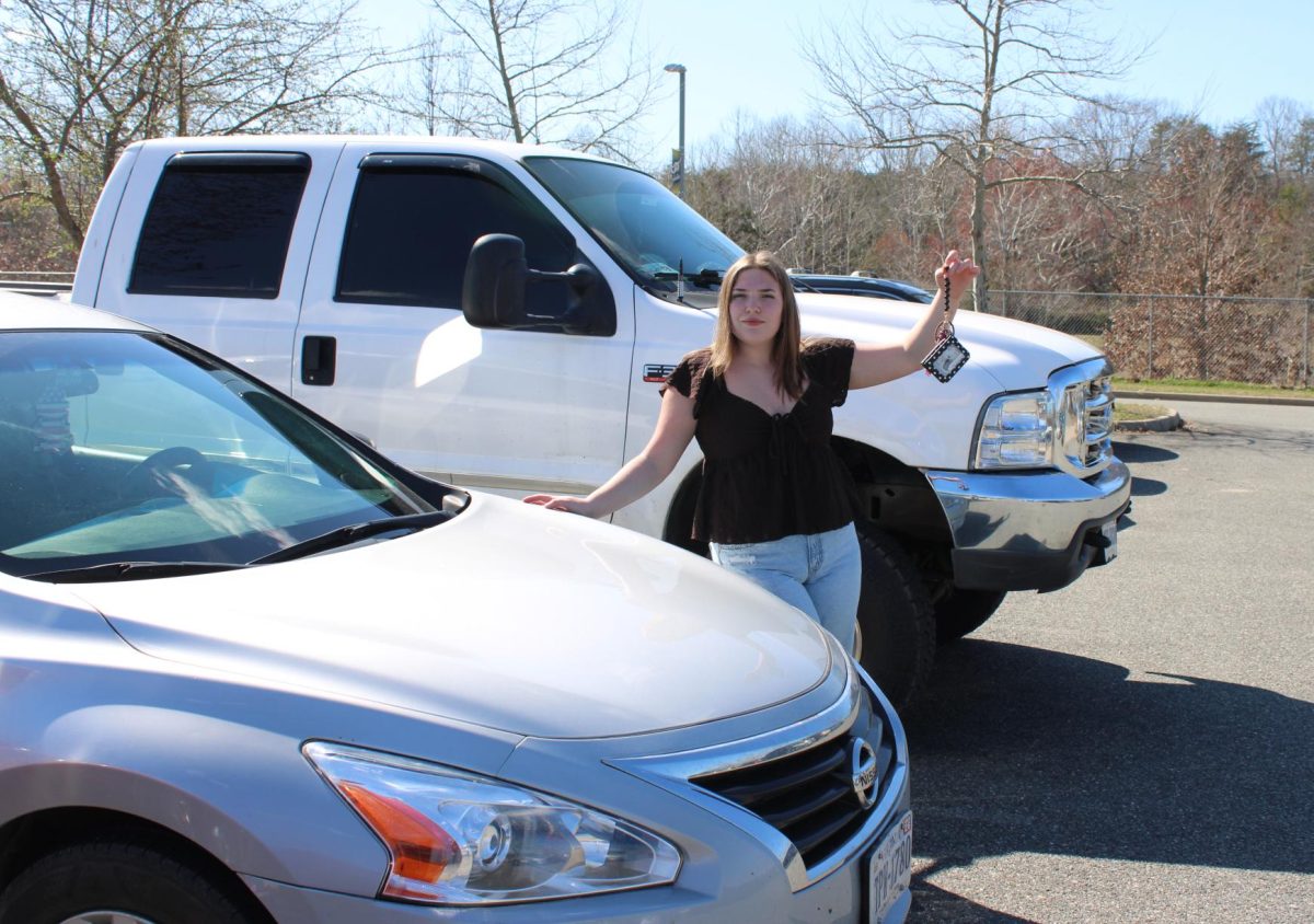Olivia McPherson '27 poses with her car.