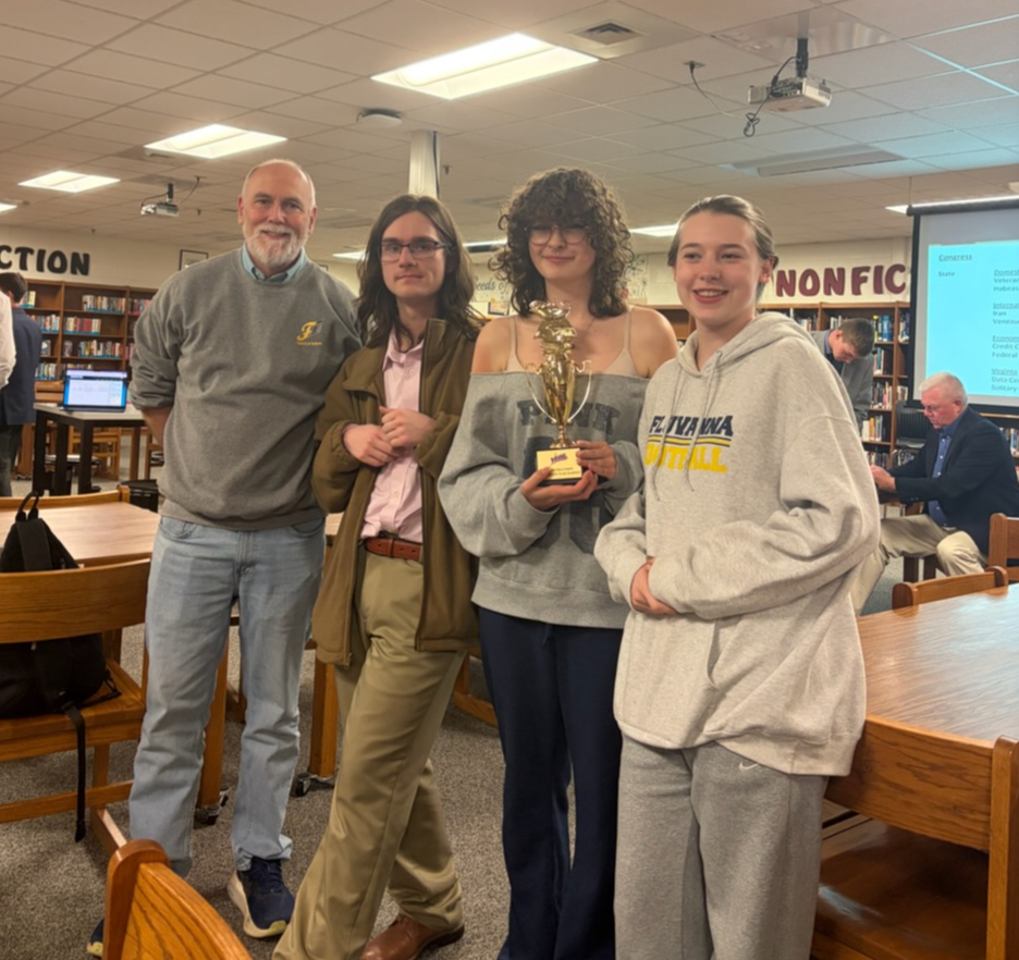 Debate Coach Luke Divine, seniors Andrew Jamison and Vanessa Vandevander, and junior Ella Grace Mann after winning awards at Super Regionals at Turner Ashby on March 21. 